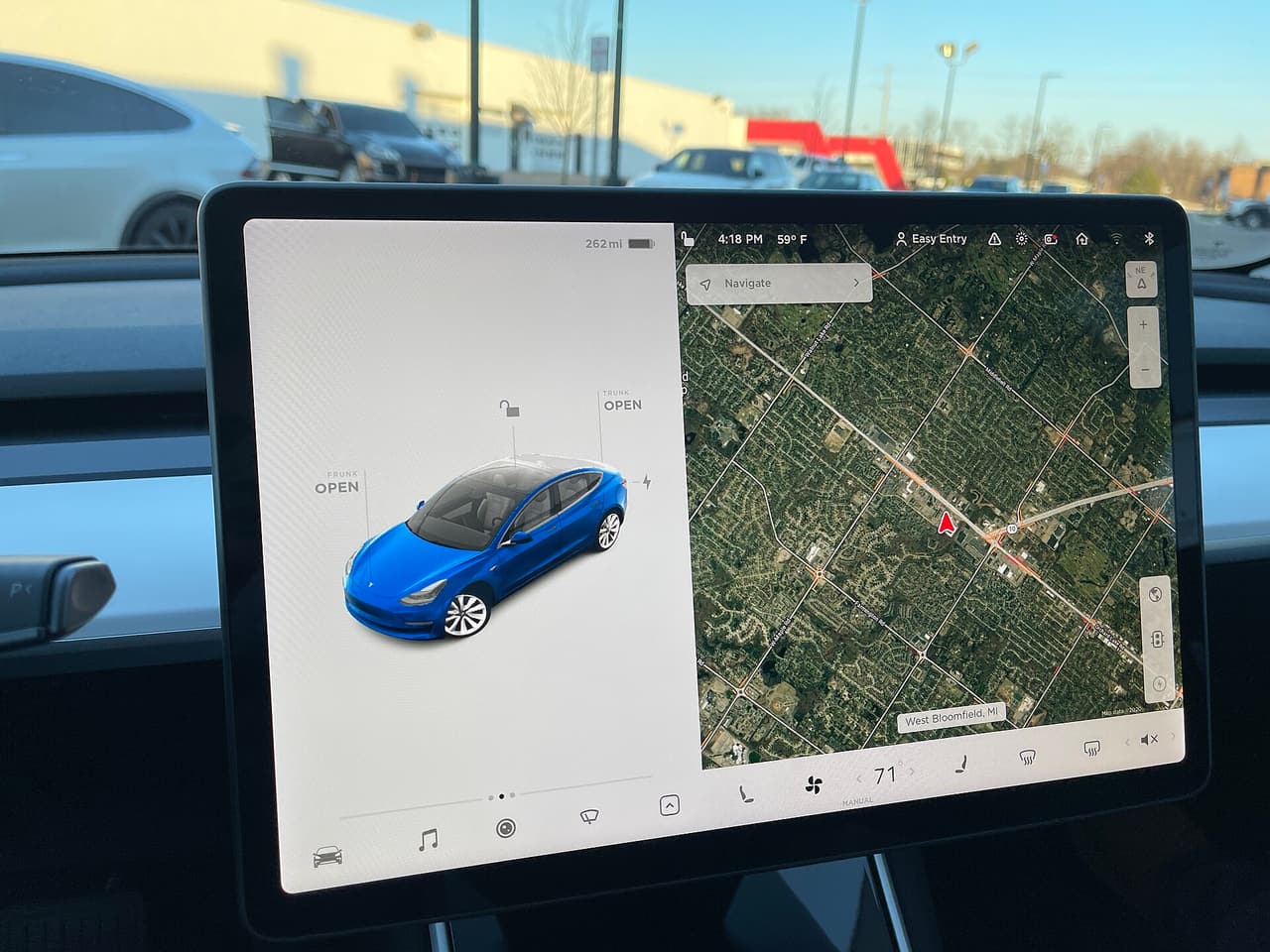 Tesla Model 3 touchscreen showing the car, the map and the bottom menu bar